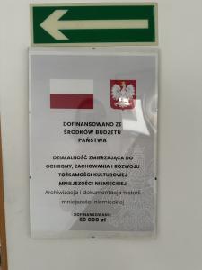 Information on subsidizing GMRC activities from the Polish state budget - poster hanging in the office part of the GMRC headquarters